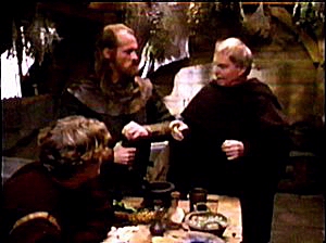 Brother Cadfael discusses the case with Hugh and one of his men.