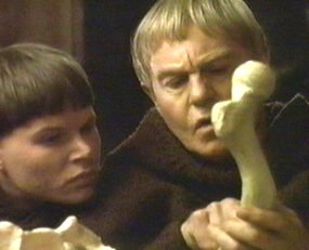 Brother Cadfael and a Novice ponder a bone