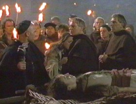 Brother Cafael and Father Abbot confront Father Ailnoth